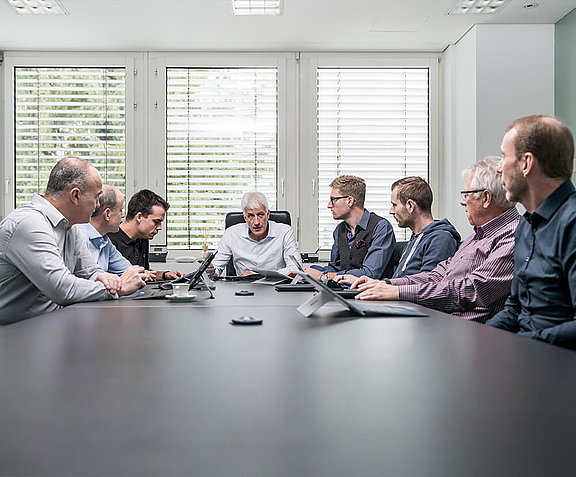 Team at a conference table in a meeting room