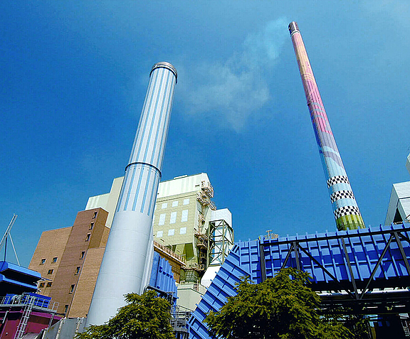 Industrial building with two large chimneys