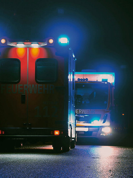 Emergency vehicles at night with blue lights