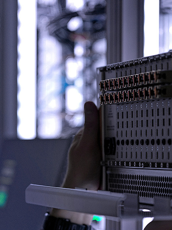 Man in illuminated server room