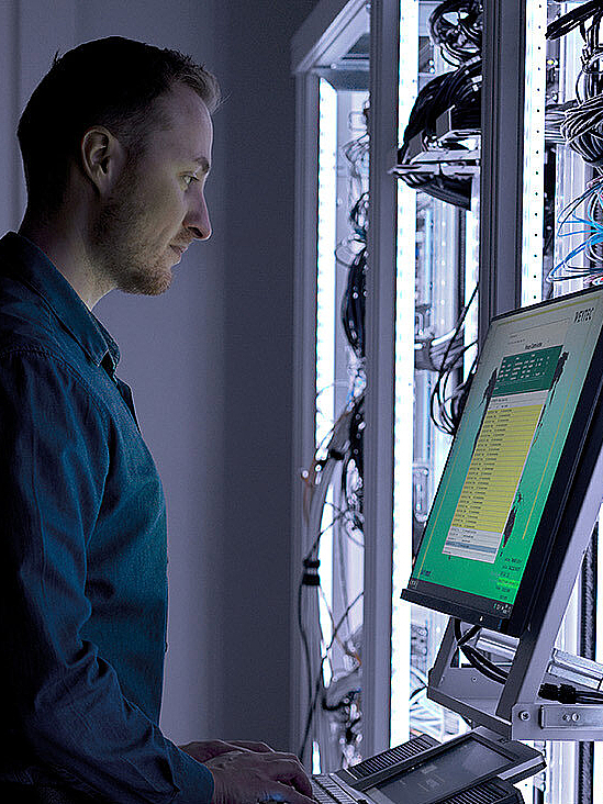 Man in illuminated server room