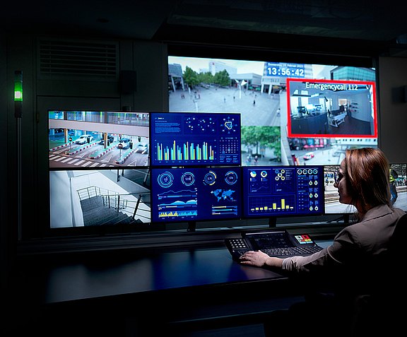 Control room workplace with screens and videowall