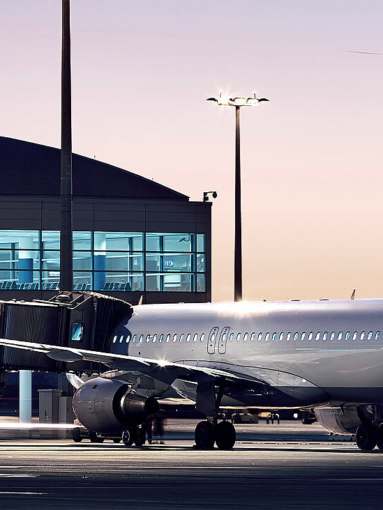  Illuminated airport at night with airplane